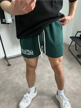 Nueva versión coreana de los músculos cortos de gimnasio de entrenamiento para hombre pantalones cortos de algodón puro impreso de la moda de los pantalones cortos de los hombres
